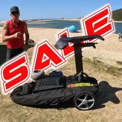 eFoil cart with wheels on the beach during sale, demonstrated by instructor